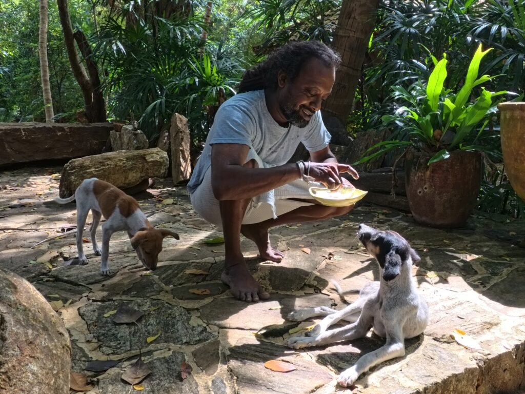 IMG_20250422_115533_320.jpg Muna with the dogs at Gem River Edge, Kataragama, Sri Lanka