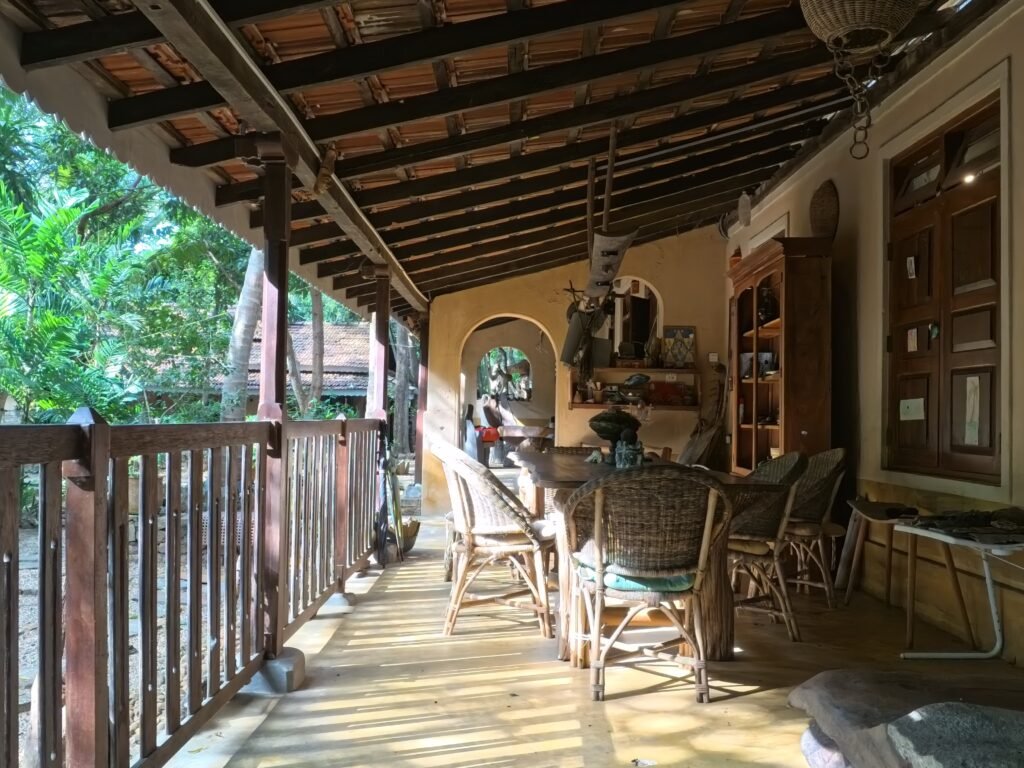 Wooden table on the veranda at Gem River Edge in Kataragama, Sri Lanka