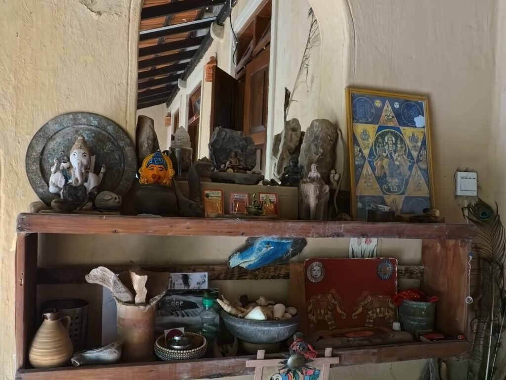 Shelf with Ganesh statue and personal objects at Gem River Edge in Kataragama