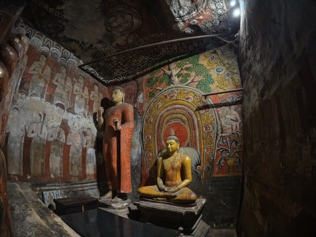 Buddha statues and ancient cave paintings inside Dambulla Cave Temple, Sri Lanka